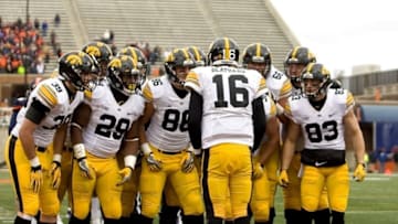 Nov 19, 2016; Champaign, IL, USA; Iowa Hawkeyes quarterback C.J. Beathard (16) calls a play in the huddle during the 2nd quarter against the Illinois Fighting Illini at Memorial Stadium. Mandatory Credit: Mike Granse-USA TODAY Sports