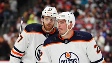 May 31, 2022; Denver, Colorado, USA; Edmonton Oilers defenseman Tyson Barrie (22) and Edmonton Oilers center Connor McDavid (97) during the first period against the Colorado Avalanche in game one of the Western Conference Final of the 2022 Stanley Cup Playoffs at Ball Arena. Mandatory Credit: Ron Chenoy-USA TODAY Sports