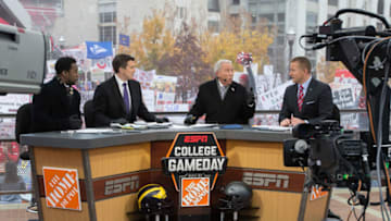 Nov 26, 2016; Columbus, OH, USA; ESPN College Gameday hosts from left Desmond Howard and Rece Davis and Lee Corso and Kirk Herbstreit discuss the days matchups on their set outside Ohio Stadium before the game between the Ohio State Buckeyes and Michigan Wolverines. Ohio State won the game 30-27 in double overtime. Mandatory Credit: Greg Bartram-USA TODAY Sports