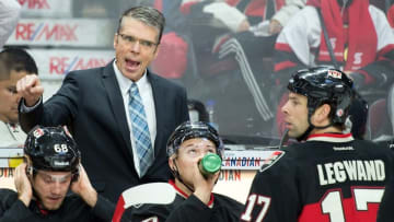 Dec 11, 2014; Ottawa, Ontario, CAN; Ottawa Senators head caoch Dave Cameron speaks to center David Legwand (17) in the first period against the Los Angeles Kings in the first period at the Canadian Tire Centre. Mandatory Credit: Marc DesRosiers-USA TODAY Sports
