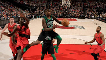 PORTLAND, OR - MARCH 23: Terry Rozier #12 of the Boston Celtics drives to the basket against the Portland Trail Blazers on March 23, 2018 at the Moda Center Arena in Portland, Oregon. NOTE TO USER: User expressly acknowledges and agrees that, by downloading and or using this photograph, user is consenting to the terms and conditions of the Getty Images License Agreement. Mandatory Copyright Notice: Copyright 2018 NBAE (Photo by Cameron Browne/NBAE via Getty Images)