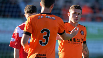 BRECHIN, SCOTLAND - JULY 03: Fraser Aird of Dundee United is congratulated by Callum Booth of Dundee United after scoring in the first half during the pre-season friendly between Brechin City and Dundee United at Glebe Park on July 3, 2018 in Brechin, Scotland. (Photo by Mark Runnacles/Getty Images)