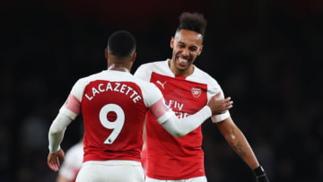LONDON, ENGLAND - APRIL 01: Pierre-Emerick Aubameyang (14) and Alexandre Lacazette of Arsenal celebrate victory after the the Premier League match between Arsenal FC and Newcastle United at Emirates Stadium on April 01, 2019 in London, United Kingdom. (Photo by Catherine Ivill/Getty Images)