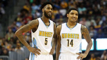 Dec 22, 2015; Denver, CO, USA; Denver Nuggets forward Will Barton (5) and guard Gary Harris (14) react during the first half against the Los Angeles Lakers at Pepsi Center. Mandatory Credit: Chris Humphreys-USA TODAY Sports