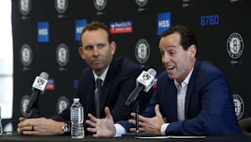 May 16, 2016; Brooklyn, NY, USA; Brooklyn Nets general manager Sean Marks listens to Brooklyn Nets new head coach Kenny Atkinson answer questions from media during press conference at HSS Training Center. Mandatory Credit: Noah K. Murray-USA TODAY Sports