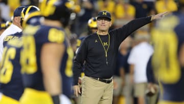ANN ARBOR, MI - OCTOBER 07: Michigan head football coach Jim Harbaugh watches the warms ups prior to the start of the game against the Michigan State Spartans at Michigan Stadium on October 7, 2017 in Ann Arbor, Michigan. Michigan State defeated Michigan 14-10. (Photo by Leon Halip/Getty Images)