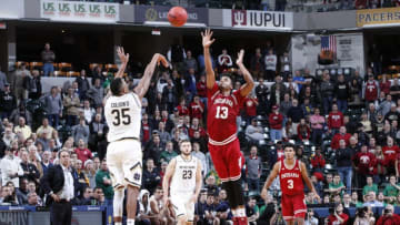 INDIANAPOLIS, IN - DECEMBER 16: Bonzie Colson #35 of the Notre Dame Fighting Irish shoots a last second three-point shot against Juwan Morgan #13 of the Indiana Hoosiers during the Crossroads Classic at Bankers Life Fieldhouse on December 16, 2017 in Indianapolis, Indiana. Indiana won 80-77 in overtime. (Photo by Joe Robbins/Getty Images)
