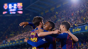 VILLAREAL, SPAIN - APRIL 02: Malcom Filipe Silva de Oliveira (C) of FC Barcelona celebrates his sides second goal with his teammate Sergi Roberto (L) and Philippe Coutinho during the La Liga match between Villarreal CF and FC Barcelona at Estadio de la Ceramica on April 2, 2019 in Villareal, Spain. (Photo by David Aliaga/MB Media/Getty Images)