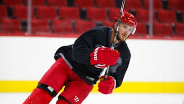 Sept 18, 2015; Raleigh, NC, USA; Carolina Hurricanes defensemen James Wisniewski (21) skates during training camp at PNC Arena. Mandatory Credit: James Guillory-USA TODAY Sports