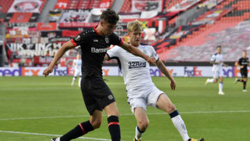LEVERKUSEN, GERMANY - AUGUST 06: Kai Havertz of Bayer Leverkusen and Filip Helander of Rangers in action during the UEFA Europa League round of 16 second leg match between Bayer 04 Leverkusen and Rangers FC at BayArena on August 06, 2020 in Leverkusen, Germany. (Photo by Martin Meissner/Pool via Getty Images)