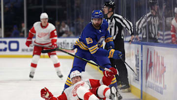 Oct 31, 2022; Buffalo, New York, USA; Buffalo Sabres right wing Alex Tuch (89) watches as Detroit Red Wings left wing Lucas Raymond (23) falls going after a loose puck during the first period at KeyBank Center. Mandatory Credit: Timothy T. Ludwig-USA TODAY Sports