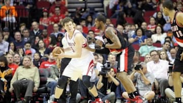 Feb 8, 2013; Houston, TX, USA; Houston Rockets center Omer Asik (3) is defended by Portland Trail Blazers power forward LaMarcus Aldridge (12) in the second quarter at the Toyota Center. Mandatory Credit: Brett Davis-USA TODAY Sports