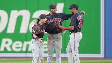TORONTO, ON - AUGUST 12: (L-R) Steven Kwan #38, Will Benson #29 and Oscar Gonzalez #39 of the Cleveland Guardians celebrate defeating the Toronto Blue Jays in their MLB game at the Rogers Centre on August 12, 2022 in Toronto, Ontario, Canada. (Photo by Mark Blinch/Getty Images)