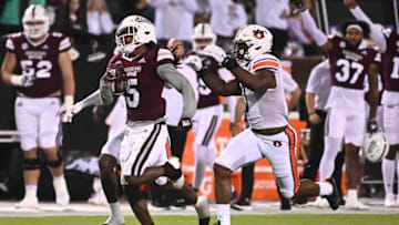 Nov 5, 2022; Starkville, Mississippi, USA; Mississippi State Bulldogs wide receiver Lideatrick Griffin (5) runs the ball while defended by Auburn Tigers linebacker Owen Pappoe (0) during the first quarter at Davis Wade Stadium at Scott Field. Mandatory Credit: Matt Bush-USA TODAY Sports
