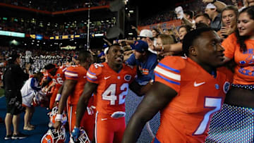 Oct 3, 2015; Gainesville, FL, USA; Florida Gators defensive back Keanu Neal (42) and teammates high five fans as they beat the Mississippi Rebels at Ben Hill Griffin Stadium. Florida Gators defeated the Mississippi Rebels 38-10. Mandatory Credit: Kim Klement-USA TODAY Sports