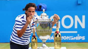 LONDON, ENGLAND - JUNE 25: Feliciano Lopez of Spain celebrates with the winners trophy following victory in the mens singles final against Marin Cilic of Croatia during day seven of the 2017 Aegon Championships at Queens Club on June 25, 2017 in London, England. (Photo by Clive Brunskill/Getty Images)