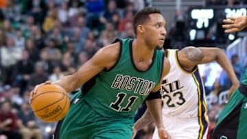 Feb 19, 2016; Salt Lake City, UT, USA; Boston Celtics guard Evan Turner (11) dribbles the ball around Utah Jazz forward Chris Johnson (23) during the first half at Vivint Smart Home Arena. Mandatory Credit: Russ Isabella-USA TODAY Sports