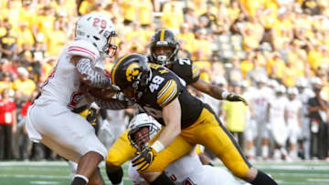 IOWA CITY, IOWA- SEPTEMBER 01: Linebacker Nick Niemann #49 and defensive back Amani Hooker #27 of the Iowa Hawkeyes stop tailback Jordan Nettles #28 of the Northern Illinois Huskies for a safety in the second half, on September 1, 2018 at Kinnick Stadium, in Iowa City, Iowa. (Photo by Matthew Holst/Getty Images)