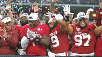 ARLINGTON, TX - DECEMBER 07: Head coach Lincoln Riley of the Oklahoma Sooners celebrates with his team including Caleb Kelly #19 and Marquise Overton #97 after defeating the Baylor Bears 30-23 in the Big 12 Football Championship at AT&T Stadium on December 7, 2019 in Arlington, Texas. (Photo by Ron Jenkins/Getty Images)
