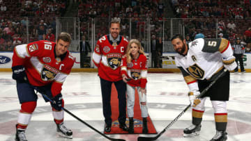 SUNRISE, FL - FEBRUARY 2: Former member of the Florida Panthers Olli Jokinen drops the ceremonial puck with his daughter Emma along with Aleksander Barkov #16 of the Florida Panthers and Deryk Engelland #5 of the Vegas Golden Knights prior to the start of the game at the BB&T Center on February 2, 2019 in Sunrise, Florida. (Photo by Eliot J. Schechter/NHLI via Getty Images)