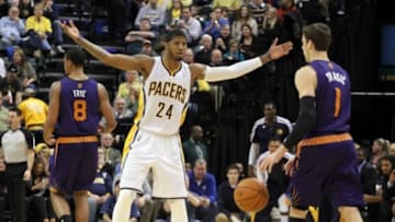Jan 30, 2014; Indianapolis, IN, USA; Phoenix Suns guard Goran Dragic (1) is guarded by Indiana Pacers forward Paul George (24) at Bankers Life Fieldhouse. Phoenix defeats Indiana 102-94. Mandatory Credit: Brian Spurlock-USA TODAY Sports