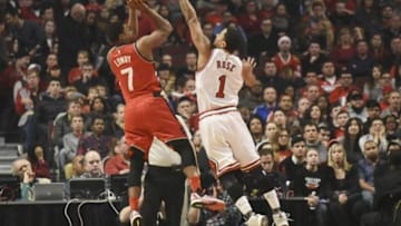 Dec 28, 2015; Chicago, IL, USA; Toronto Raptors guard Kyle Lowry (7) shoots the ball over Chicago Bulls guard Derrick Rose (1) during the first half at the United Center. Mandatory Credit: David Banks-USA TODAY Sports