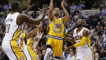 Dec 8, 2015; Indianapolis, IN, USA; Golden State Warriors guard Stephen Curry (30) takes a shot against Indiana Pacers center Ian Mahinmi (28) and guard C.J. Miles (0) at Bankers Life Fieldhouse. Golden State defeats Indiana 131-123. Mandatory Credit: Brian Spurlock-USA TODAY Sports