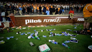Trash litters the sidelines after it was ruled that Jacob Warren was a yard short of the first down marker on a 4th and 24 play during an SEC football game between Tennessee and Ole Miss at Neyland Stadium in Knoxville, Tenn. on Saturday, Oct. 16, 2021. Tennessee fans littered the Neyland Stadium field with debris for several minutes following Ole Miss' game-clinching defensive stop with 54 seconds to play.Kns Tennessee Ole Miss Football