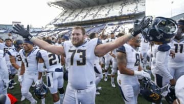 Sep 26, 2015; Seattle, WA, USA; California Golden Bears offensive lineman Jordan Rigsbee (73) celebrates the 30-24 win over the Washington Huskies at Husky Stadium. Mandatory Credit: Jennifer Buchanan-USA TODAY Sports