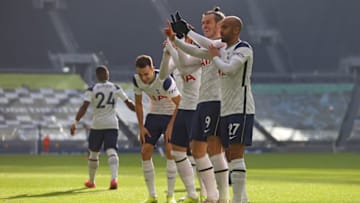 Tottenham Hotspur's Welsh midfielder Gareth Bale (2R) celebrates scoring the opening goal with Tottenham Hotspur's Brazilian midfielder Lucas Moura (R) during the English Premier League football match between Tottenham Hotspur and Burnley at Tottenham Hotspur Stadium in London, on February 28, 2021. (Photo by JULIAN FINNEY/POOL/AFP via Getty Images)