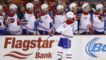 Nov 16, 2014; Detroit, MI, USA; Montreal Canadiens right wing Brendan Gallagher (11) receives congratulations from teammates after scoring in the third period against the Detroit Red Wings at Joe Louis Arena. Montreal won 4-1. Mandatory Credit: Rick Osentoski-USA TODAY Sports