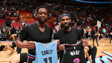 MIAMI, FL - JANUARY 12: Dwyane Wade #3 of the Miami Heat and Mike Conley #11 of the Memphis Grizzlies exchange jerseys after the game on January 12, 2019 at American Airlines Arena in Miami, Florida. NOTE TO USER: User expressly acknowledges and agrees that, by downloading and/or using this photograph, user is consenting to the terms and conditions of the Getty Images License Agreement. Mandatory Copyright Notice: Copyright 2019 NBAE (Photo by Issac Baldizon/NBAE via Getty Images)