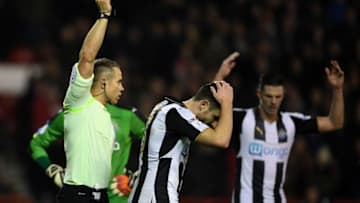 NOTTINGHAM, ENGLAND - DECEMBER 02: Referee Stephen Martin shows a red card to Paul Dummett of Newcastle United during the Sky Bet Championship match between Nottingham Forest and Newcastle United at City Ground on December 2, 2016 in Nottingham, England. (Photo by Laurence Griffiths/Getty Images)