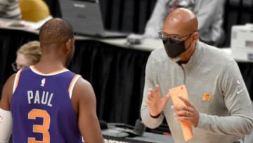 Monty Williams head coach of the Phoenix Suns speaks with Chris Paul (Photo by Steve Dykes/Getty Images)