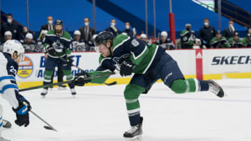 Feb 19, 2021; Vancouver, British Columbia, CAN; Vancouver Canucks forward Brock Boeser (6) shoots against the Winnipeg Jets in the first period at Rogers Arena. Mandatory Credit: Bob Frid-USA TODAY Sports