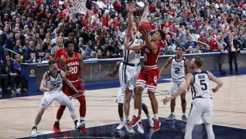 INDIANAPOLIS, IN - DECEMBER 15: Rob Phinisee #10 of the Indiana Hoosiers drives to the basket against Joey Brunk #50 of the Butler Bulldogs in the first half of the Crossroads Classic at Bankers Life Fieldhouse on December 15, 2018 in Indianapolis, Indiana. Indiana won 71-68. (Photo by Joe Robbins/Getty Images)