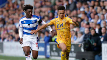 LONDON, ENGLAND - AUGUST 25: Antonee Robinson of Wigan Athletic and Ebere Eze of Queens Park Rangers during the Sky Bet Championship match between Queens Park Rangers and Wigan Athletic at Loftus Road on August 25, 2018 in London, England. (Photo by Henry Browne/Getty Images)