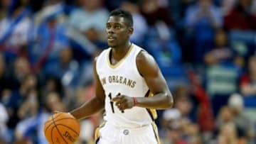 Dec 2, 2014; New Orleans, LA, USA; New Orleans Pelicans guard Jrue Holiday (11) against the Oklahoma City Thunder during a game at the Smoothie King Center. The Pelicans defeated the Thunder 112-104. Mandatory Credit: Derick E. Hingle-USA TODAY Sports