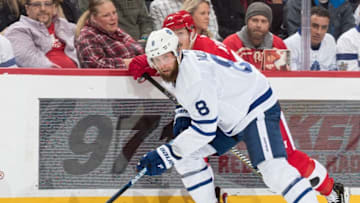 DETROIT, MI - FEBRUARY 01: Jake Muzzin #8 of the Toronto Maple Leafs skates up ice looking for the puck in front of Gustav Nyquist #14 of the Detroit Red Wings during an NHL game at Little Caesars Arena on February 1, 2019 in Detroit, Michigan. (Photo by Dave Reginek/NHLI via Getty Images)