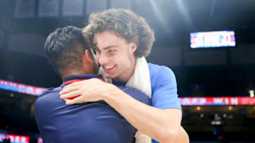 Josh Giddey #3 of the Oklahoma City Thunder hugs an Adelaide 36ers staff member after his team's 131-98 win at Paycom Center on October 06, 2022 in Oklahoma City, Oklahoma. (Photo by Ian Maule/Getty Images)
