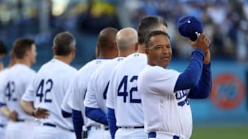 LOS ANGELES, CA - APRIL 15: Manager Dave Roberts #30 of the Los Angeles Dodgers applauds after the singing of the National Anthem prior to the MLB game against the Arizona Diamondbacks at Dodger Stadium on April 15, 2017 in Los Angeles, California. All MLB players are wearing #42 in honor of Jackie Robinson Day. The Dodgers defeated the Diamondbacks 8-4. (Photo by Victor Decolongon/Getty Images)