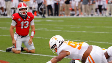 ATHENS, GEORGIA - OCTOBER 10: Kivon Bennett #95 of the Tennessee Volunteers recovers a fumble by Stetson Bennett #13 of the Georgia Bulldogs for a touchdown during the first half at Sanford Stadium on October 10, 2020 in Athens, Georgia. (Photo by Kevin C. Cox/Getty Images)