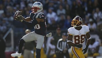 Nov 8, 2015; Foxborough, MA, USA; New England Patriots cornerback Logan Ryan (26) intercepts a pass intended for Washington Redskins wide receiver Pierre Garcon (88) during the first quarter at Gillette Stadium. Mandatory Credit: Greg M. Cooper-USA TODAY Sports