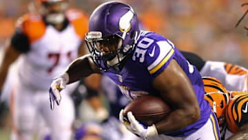 Aug 12, 2016; Cincinnati, OH, USA; Minnesota Vikings running back C.J. Ham (30) carries the ball for a touchdown in the second half against the Cincinnati Bengals in a preseason NFL football game at Paul Brown Stadium. The Vikings won 17-16. Mandatory Credit: Aaron Doster-USA TODAY Sports