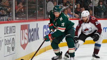 ST. PAUL, MN - OCTOBER 27: Zach Parise #11 of the Minnesota Wild skates with the puck as Ian Cole #28 of the Colorado Avalanche gives chase during a game between the Minnesota Wild and Colorado Avalanche at Xcel Energy Center on October 27, 2018 in St. Paul, Minnesota.(Photo by Bruce Kluckhohn/NHLI via Getty Images)