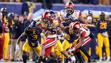 Nov 23, 2018; Morgantown, WV, USA; Oklahoma Sooners running back Kennedy Brooks (26) runs the ball during the third quarter against the West Virginia Mountaineers at Mountaineer Field at Milan Puskar Stadium. Mandatory Credit: Ben Queen-USA TODAY Sports