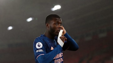 SOUTHAMPTON, ENGLAND - JANUARY 26: Nicolas Pepe of Arsenal celebrates his goal during the Premier League match between Southampton and Arsenal at St Mary's Stadium on January 26, 2021 in Southampton, United Kingdom. Sporting stadiums around the UK remain under strict restrictions due to the Coronavirus Pandemic as Government social distancing laws prohibit fans inside venues resulting in games being played behind closed doors. (Photo by Marc Atkins/Getty Images)