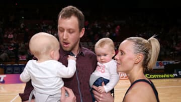 ADELAIDE, AUSTRALIA - MAY 28: Renae Ingles of the Thunderbirds celebrates her last game with husband Joe and twins Jacob and Milla during the round 14 Super Netball match between the Thunderbirds and Magpies at Titanium Security Arena on May 28, 2017 in Adelaide, Australia. (Photo by James Elsby/Getty Images)