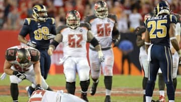 Sep 14, 2014; Tampa, FL, USA; Tampa Bay Buccaneers wide receiver Mike Evans (13) lays on the ground after getting hit by St. Louis Rams defensive back T.J. McDonald (25) on the last play of the game at Raymond James Stadium. Mandatory Credit: Jonathan Dyer-USA TODAY Sports