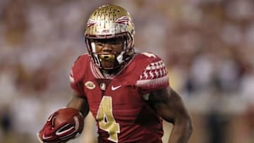 Oct 24, 2015; Atlanta, GA, USA; Florida State Seminoles running back Dalvin Cook (4) runs the ball against the Georgia Tech Yellow Jackets in the fourth quarter at Bobby Dodd Stadium. Georgia Tech defeated Florida State 22-16. Mandatory Credit: Brett Davis-USA TODAY Sports